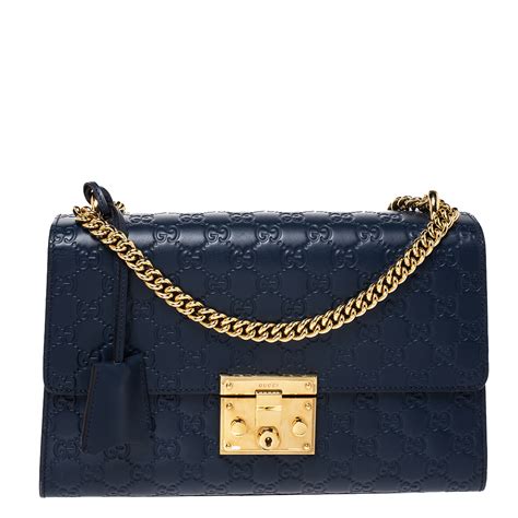 navy blue Gucci handbag